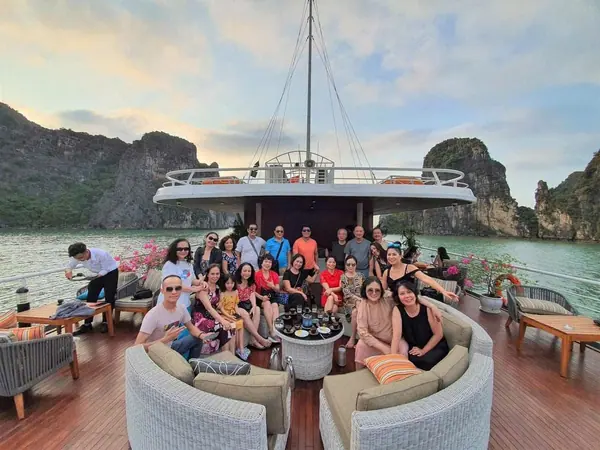 A group of guests on the deck of a bay cruise