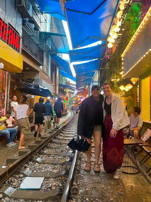 A guest and guide on Hanoi Train Street