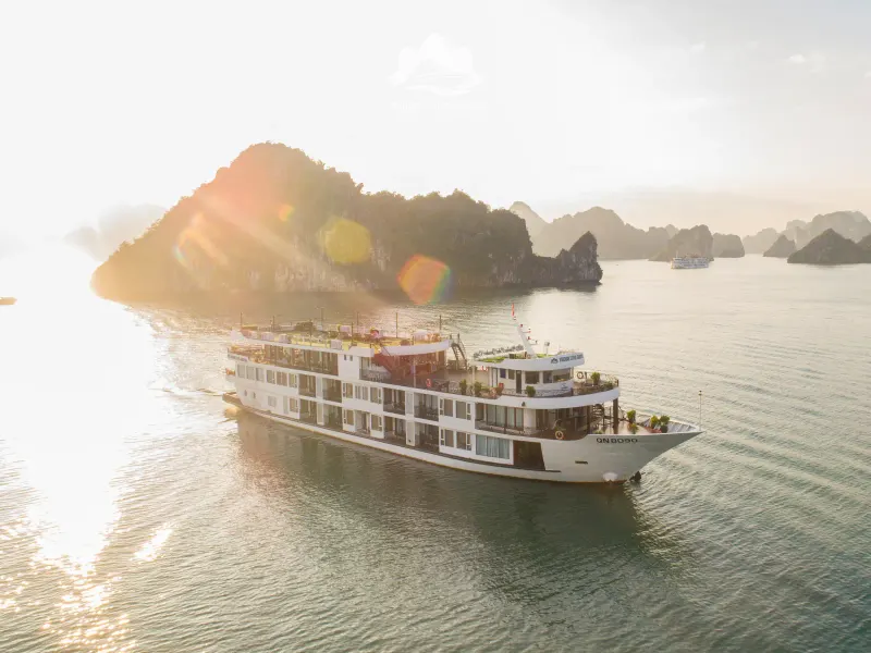The Verdure Lotus Grandeur cruising past limestone islands in Ha Long Bay
