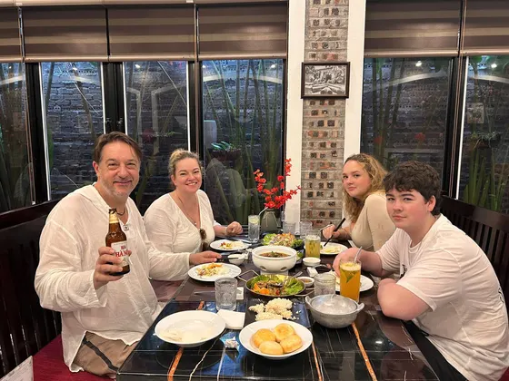A family sharing a Vietnamese lunch in Ninh Bình
