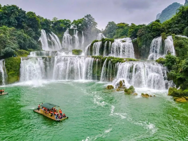 Bamboo rafts below the tiers of Ban Gioc Waterfall in Cao Bang